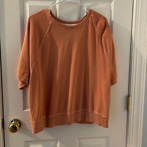orange short sleeve sweatshirt